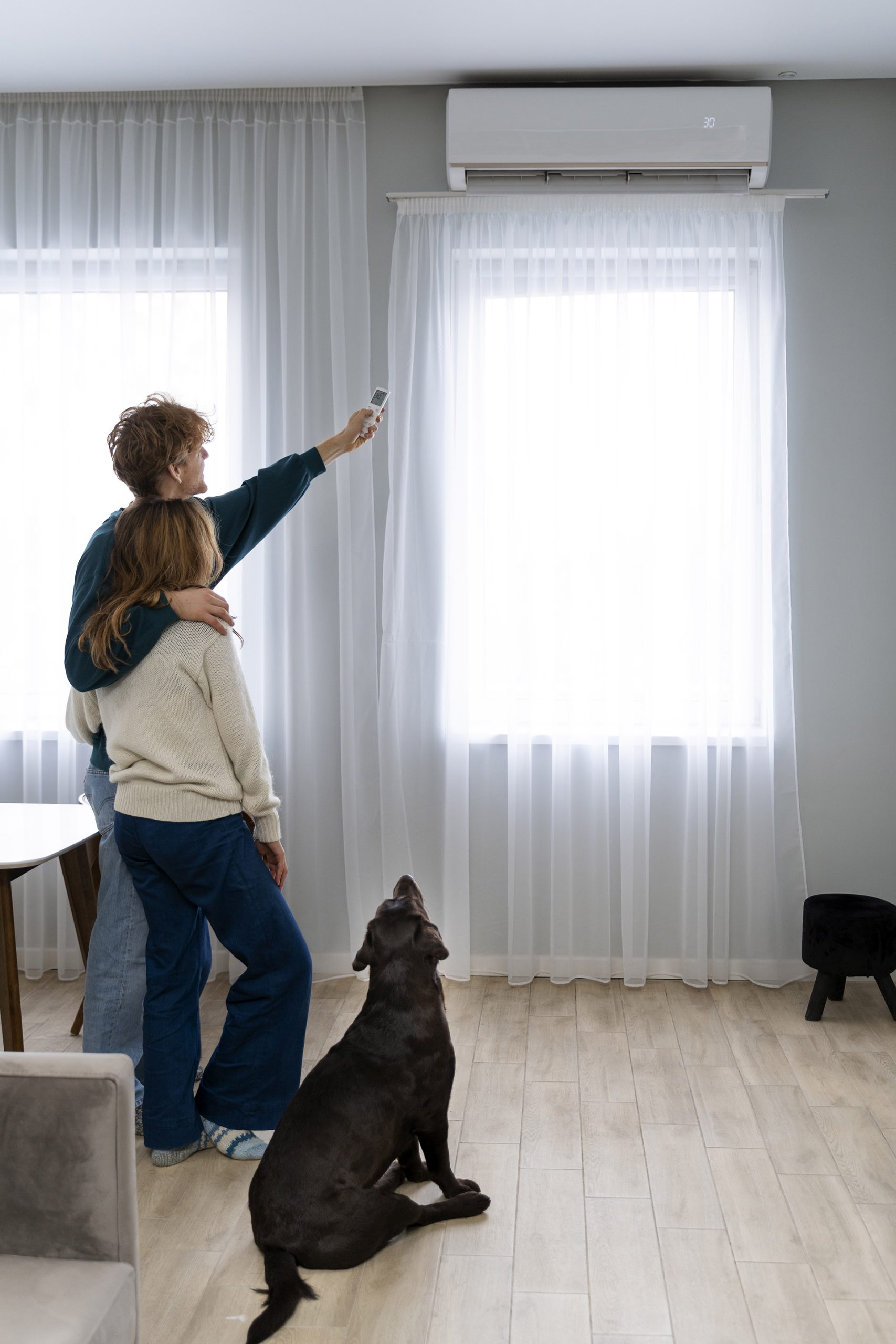 full-shot-couple-dog-home